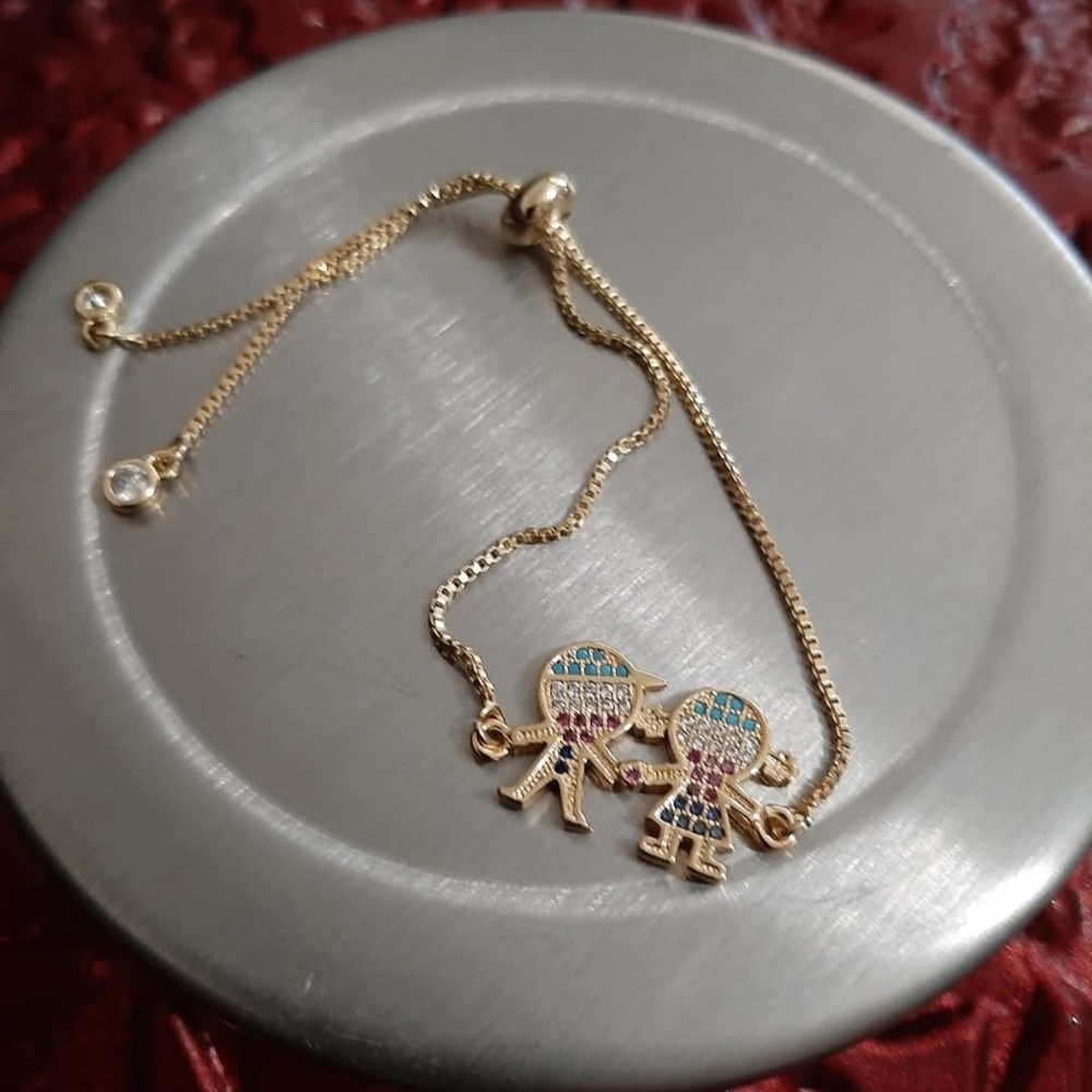 "Gold Charm Bracelet with Colorful Accents"